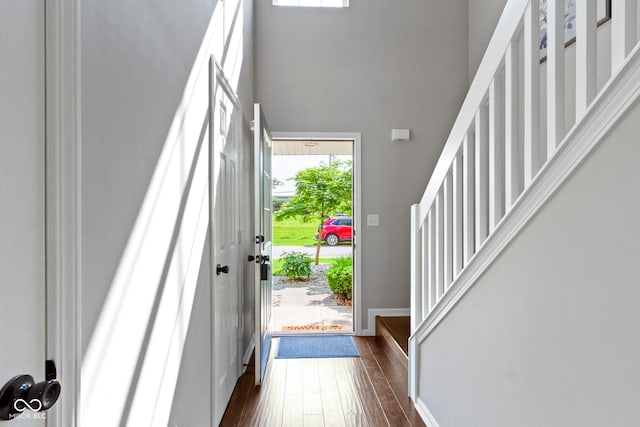603 Daviess Dr, Westfield, IN 46074 - entryway featuring dark wood-style flooring, a towering ceiling, baseboards, and stairs