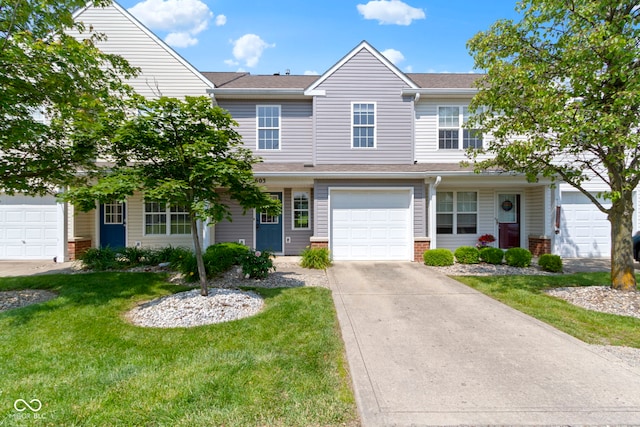 603 Daviess Dr, Westfield, IN 46074 - multi unit property featuring a front lawn, concrete driveway, brick siding, and roof with shingles
