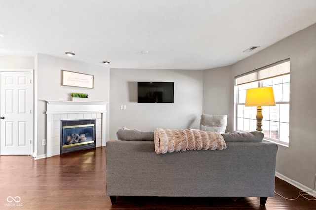 603 Daviess Dr, Westfield, IN 46074 - living room featuring wood finished floors, baseboards, and a tile fireplace