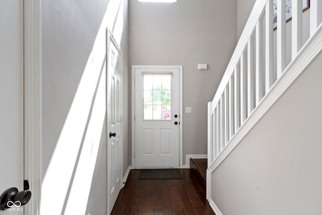 603 Daviess Dr, Westfield, IN 46074 - foyer entrance featuring dark wood-style floors, baseboards, a high ceiling, and stairway