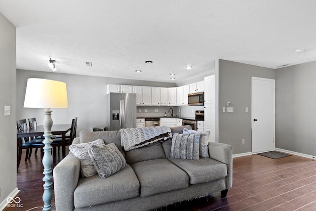 603 Daviess Dr, Westfield, IN 46074 - living area featuring dark wood-style floors, baseboards, and recessed lighting