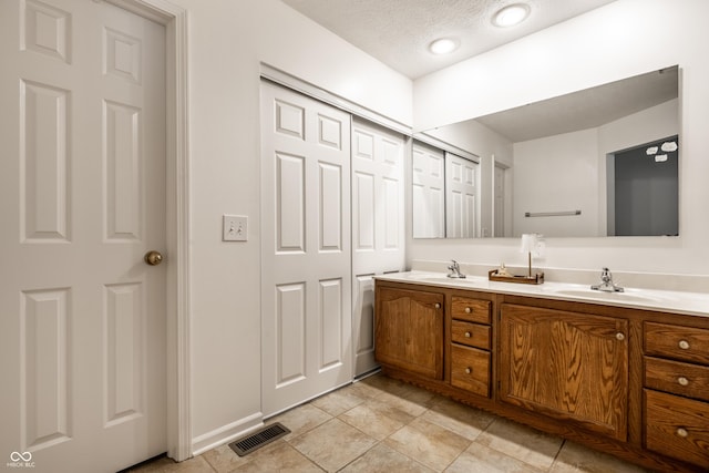 8223 Thoroughbred Run, Indianapolis, IN 46256 - full bathroom with double vanity and a textured ceiling