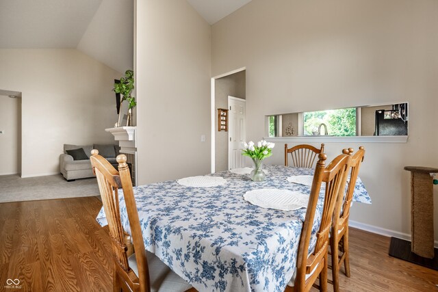 8223 Thoroughbred Run, Indianapolis, IN 46256 - dining room featuring wood finished floors, lofted ceiling, and baseboards