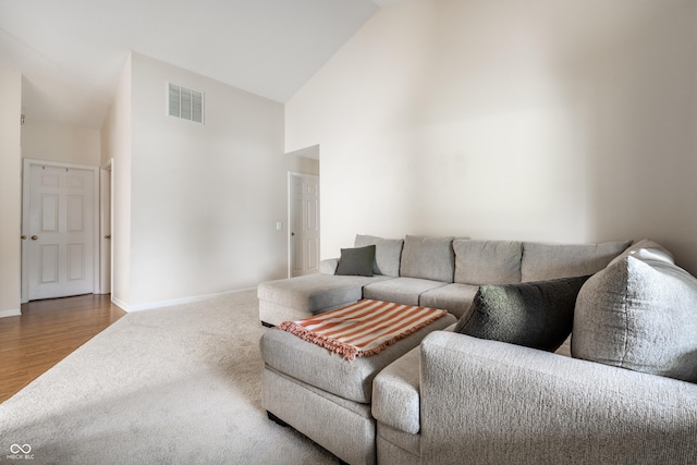 8223 Thoroughbred Run, Indianapolis, IN 46256 - living area featuring high vaulted ceiling, carpet floors, and baseboards