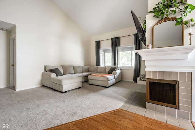 8223 Thoroughbred Run, Indianapolis, IN 46256 - carpeted living area with high vaulted ceiling, a tiled fireplace, and baseboards