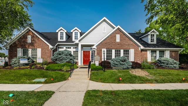 8223 Thoroughbred Run, Indianapolis, IN 46256 - view of front of property with brick siding and a front yard