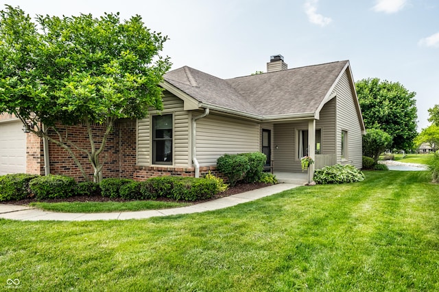 8223 Thoroughbred Run, Indianapolis, IN 46256 - view of front of home featuring a chimney, a front lawn, brick siding, a garage, and roof with shingles