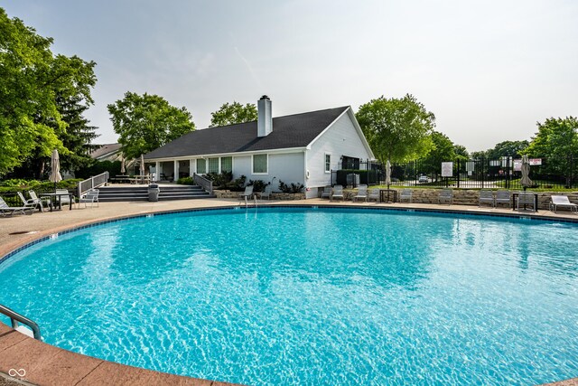 8223 Thoroughbred Run, Indianapolis, IN 46256 - community pool featuring a patio