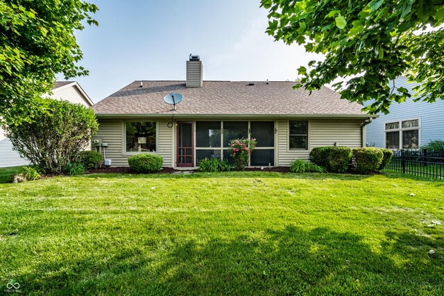 8223 Thoroughbred Run, Indianapolis, IN 46256 - rear view of property with a chimney, roof with shingles, and a sunroom