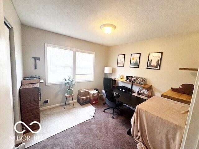 1820 Martin St, Indianapolis, IN 46237 - carpeted bedroom with a desk