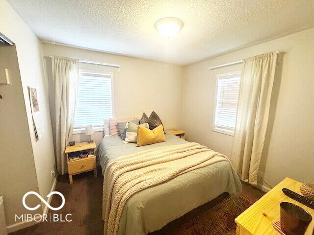 1820 Martin St, Indianapolis, IN 46237 - bedroom featuring a textured ceiling and dark wood-type flooring