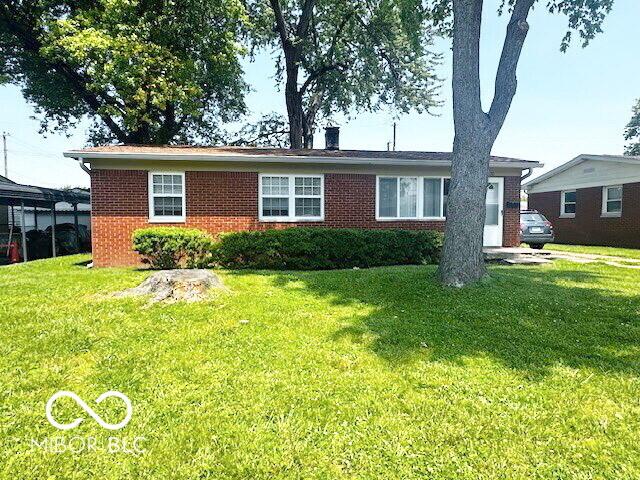 1820 Martin St, Indianapolis, IN 46237 - single story home with brick siding, a chimney, and a front yard