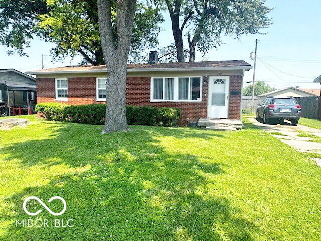 1820 Martin St, Indianapolis, IN 46237 - view of front of property featuring brick siding and a chimney
