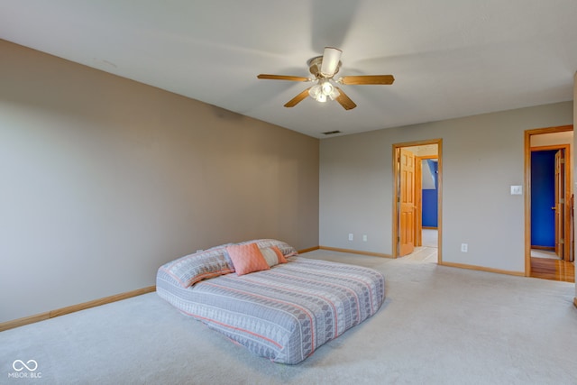 8371 N 400 W, Fairland, IN 46126 - bedroom with light carpet, baseboards, and a ceiling fan