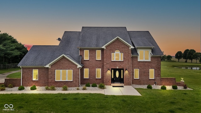 8371 N 400 W, Fairland, IN 46126 - view of front of property featuring a front lawn, brick siding, and roof with shingles