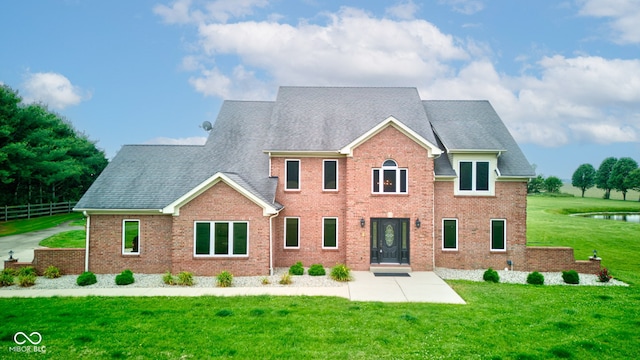 8371 N 400 W, Fairland, IN 46126 - view of front facade featuring a patio, brick siding, and a shingled roof