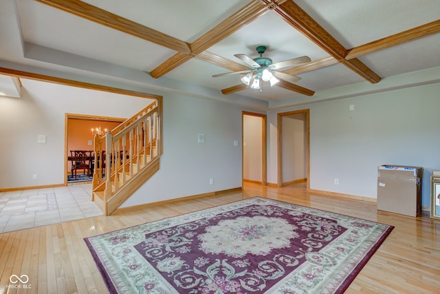 8371 N 400 W, Fairland, IN 46126 - spare room with coffered ceiling, hardwood / wood-style flooring, a chandelier, stairway, and a ceiling fan