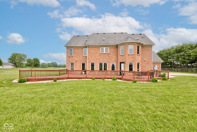 8371 N 400 W, Fairland, IN 46126 - back of house featuring brick siding, a lawn, and a deck