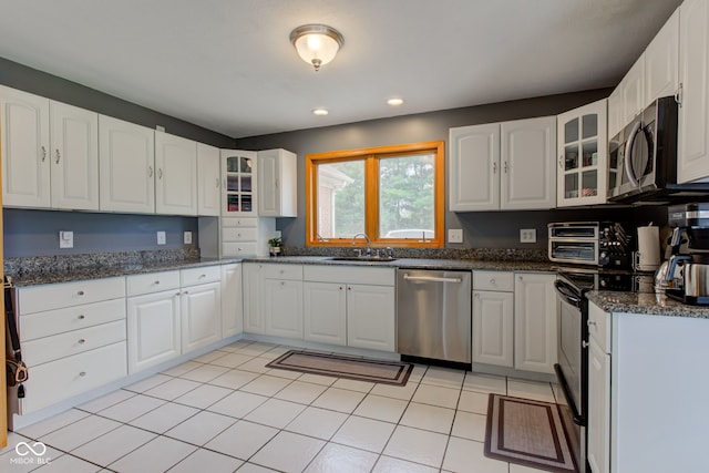 8371 N 400 W, Fairland, IN 46126 - kitchen featuring stainless steel appliances, a sink, glass insert cabinets, white cabinets, and recessed lighting