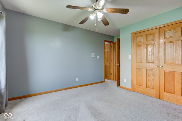 8371 N 400 W, Fairland, IN 46126 - unfurnished bedroom featuring carpet, baseboards, ceiling fan, and a closet