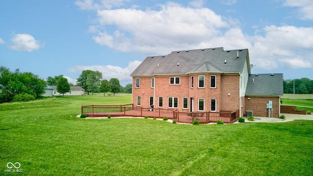 8371 N 400 W, Fairland, IN 46126 - rear view of house with brick siding, a yard, cooling unit, and a wooden deck