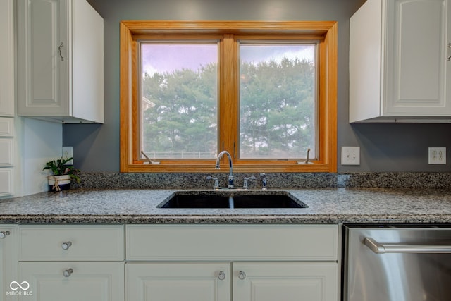 8371 N 400 W, Fairland, IN 46126 - kitchen featuring stainless steel dishwasher, a sink, white cabinetry, and stone countertops