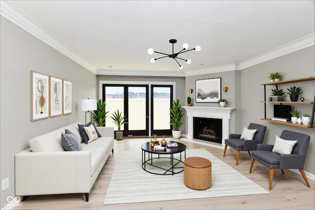 1053 Millwood Ct Unit 3, Indianapolis, IN 46260 - living area featuring light wood finished floors, crown molding, a chandelier, a fireplace with raised hearth, and baseboards