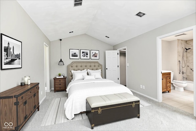 1053 Millwood Ct Unit 3, Indianapolis, IN 46260 - bedroom featuring vaulted ceiling, light carpet, connected bathroom, and baseboards