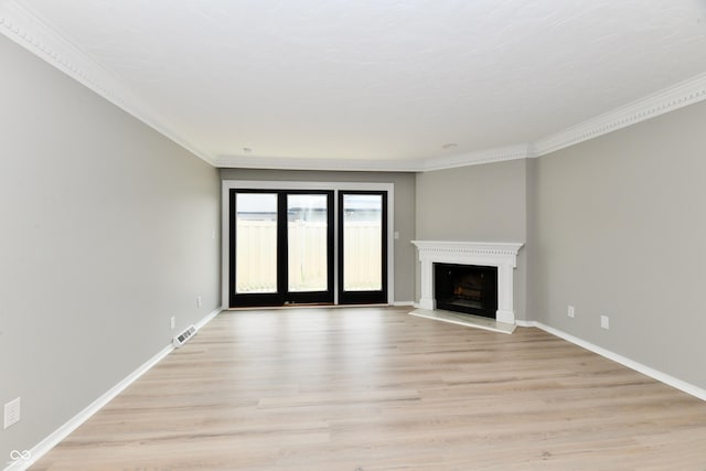 1053 Millwood Ct Unit 3, Indianapolis, IN 46260 - unfurnished living room featuring light wood-style flooring, ornamental molding, a fireplace with raised hearth, and baseboards