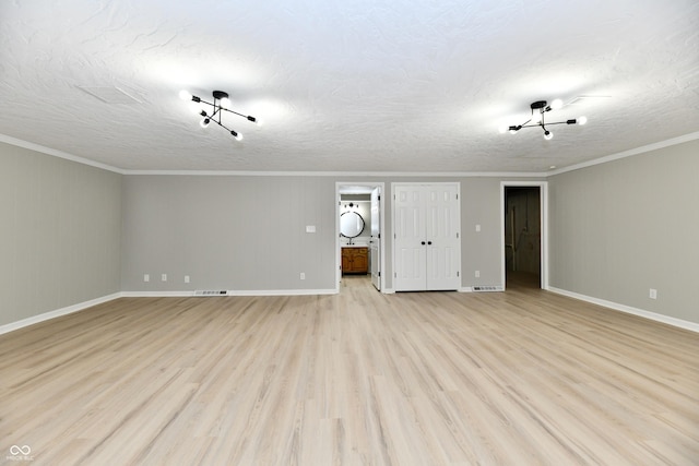 1053 Millwood Ct Unit 3, Indianapolis, IN 46260 - unfurnished living room with light wood finished floors, crown molding, baseboards, and a textured ceiling