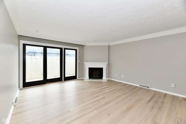 1053 Millwood Ct Unit 3, Indianapolis, IN 46260 - unfurnished living room featuring light wood-style floors, baseboards, crown molding, and a fireplace