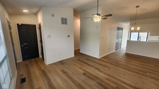 1836 Queensbridge Cir, Indianapolis, IN 46219 - unfurnished room with wood finished floors, a ceiling fan, baseboards, vaulted ceiling, and a sink