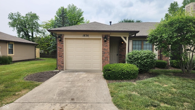 1836 Queensbridge Cir, Indianapolis, IN 46219 - view of front facade featuring brick siding, driveway, an attached garage, and a shingled roof