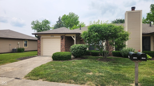 1836 Queensbridge Cir, Indianapolis, IN 46219 - view of front of property with brick siding, concrete driveway, a front yard, an attached garage, and a chimney