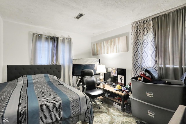 2832 Hillside Ave, Indianapolis, IN 46218 - bedroom featuring a textured ceiling and an office area