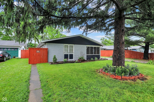2832 Hillside Ave, Indianapolis, IN 46218 - view of front of property featuring brick siding and a gate