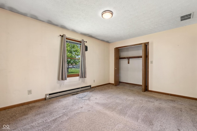 5380 Collett Dr E, Camby, IN 46113 - unfurnished bedroom featuring baseboard heating, carpet flooring, baseboards, a textured ceiling, and a closet