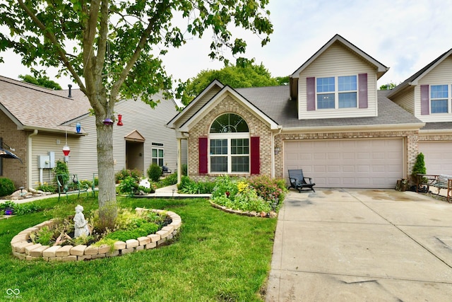 2805 Rylee Ct, Greenwood, IN 46143 - view of front facade featuring brick siding, driveway, an attached garage, and a front lawn