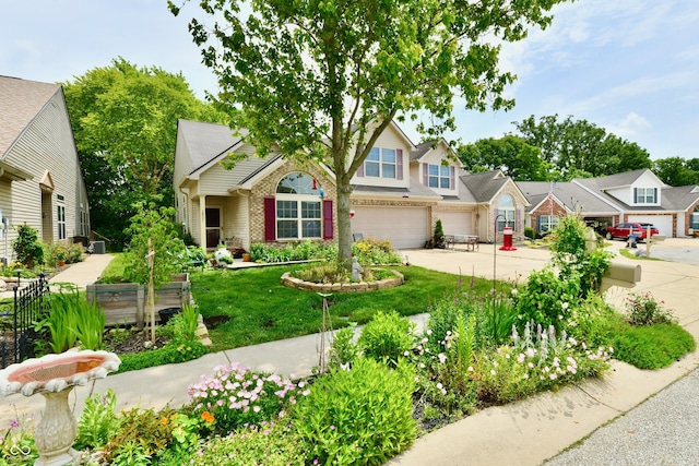 2805 Rylee Ct, Greenwood, IN 46143 - view of front of house featuring driveway, an attached garage, a front lawn, and brick siding