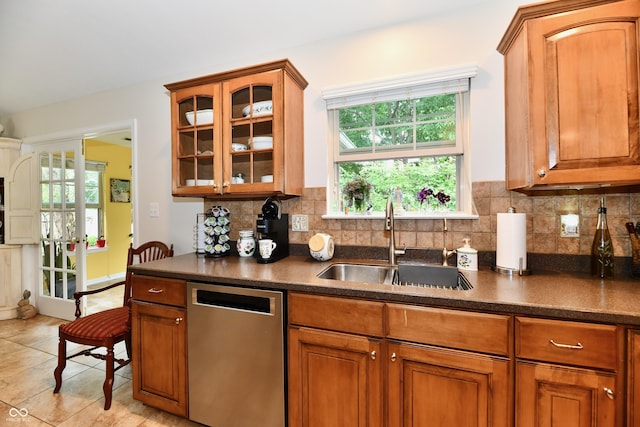 2805 Rylee Ct, Greenwood, IN 46143 - kitchen featuring dishwasher, a sink, dark countertops, and glass insert cabinets