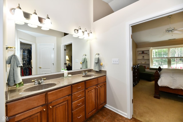 2805 Rylee Ct, Greenwood, IN 46143 - full bathroom with ensuite bath, double vanity, baseboards, a ceiling fan, and tile patterned flooring