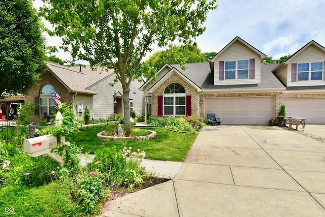 2805 Rylee Ct, Greenwood, IN 46143 - view of front of property featuring brick siding, concrete driveway, an attached garage, a front lawn, and roof with shingles
