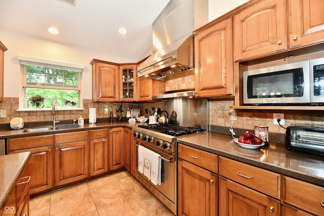 2805 Rylee Ct, Greenwood, IN 46143 - kitchen featuring appliances with stainless steel finishes, extractor fan, a sink, brown cabinetry, and light tile patterned floors