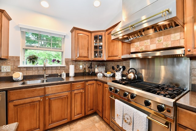 2805 Rylee Ct, Greenwood, IN 46143 - kitchen featuring extractor fan, appliances with stainless steel finishes, a sink, brown cabinetry, and vaulted ceiling