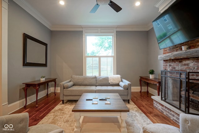 1512 Bellefontaine St, Indianapolis, IN 46202 - living area with ornamental molding, a ceiling fan, a fireplace, wood finished floors, and recessed lighting