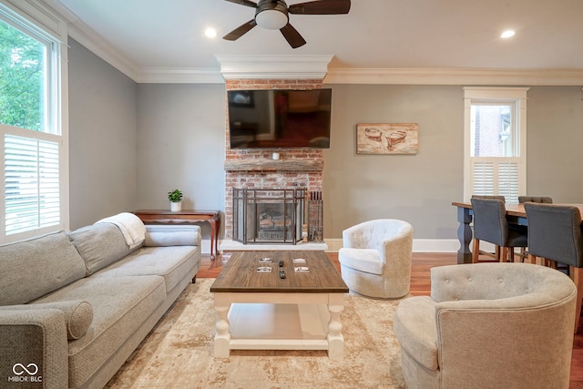 1512 Bellefontaine St, Indianapolis, IN 46202 - living area with wood finished floors, ceiling fan, a fireplace, ornamental molding, and recessed lighting