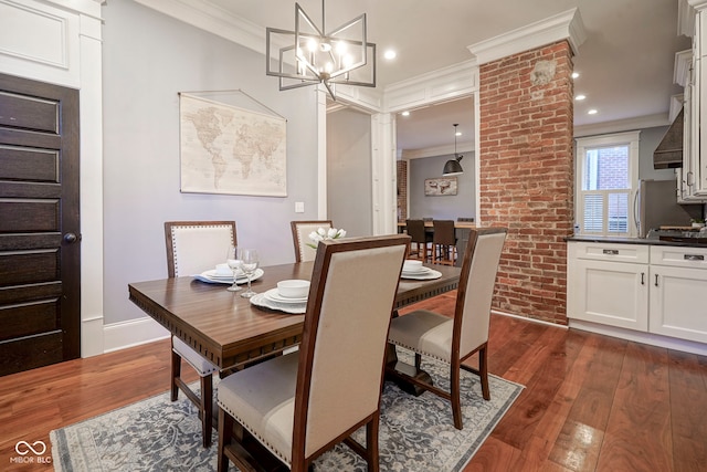 1512 Bellefontaine St, Indianapolis, IN 46202 - dining area with ornamental molding, dark wood-type flooring, ornate columns, recessed lighting, and a chandelier