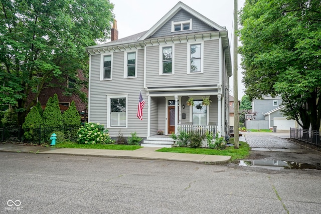 1512 Bellefontaine St, Indianapolis, IN 46202 - view of front of home featuring covered porch and a chimney