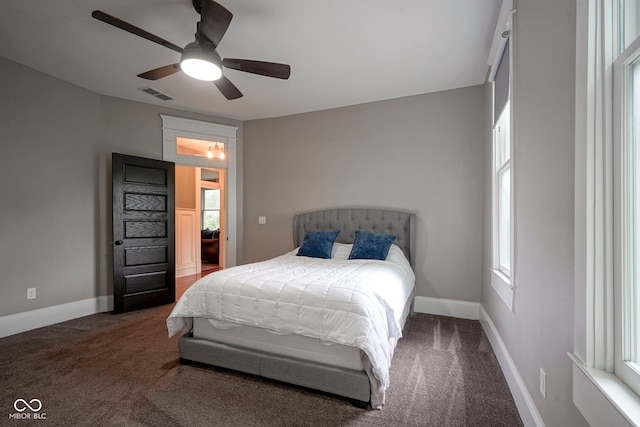 1512 Bellefontaine St, Indianapolis, IN 46202 - bedroom with carpet flooring, baseboards, and a ceiling fan