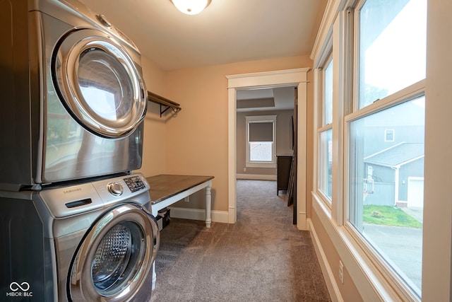 1512 Bellefontaine St, Indianapolis, IN 46202 - laundry room with estacked washer and dryer, carpet floors, and baseboards